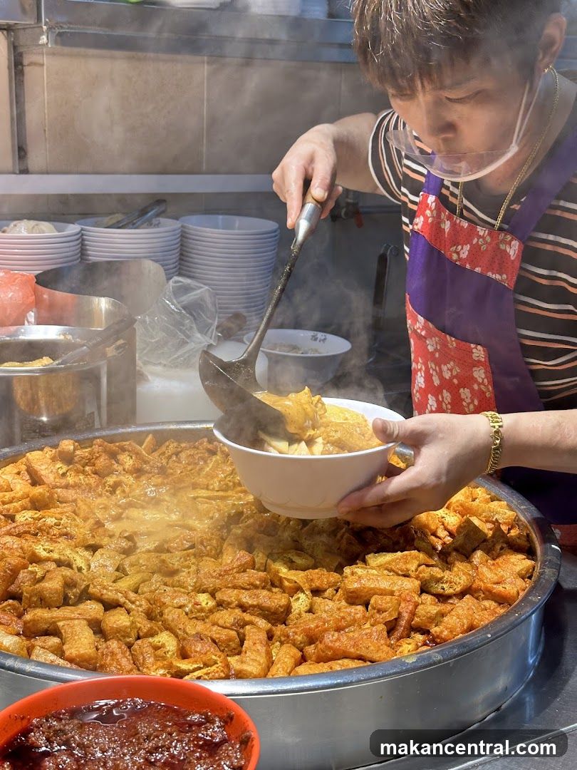 Food Vendor Serving Noodles