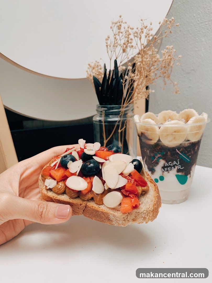Toast with fruit and nuts and acai bowl