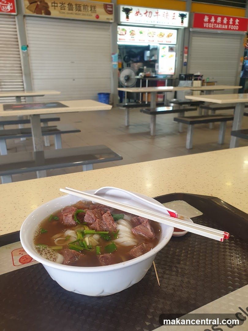 Beef noodle soup with chopsticks