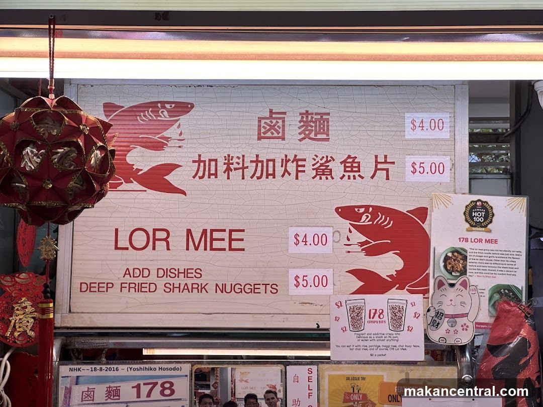 Food stall menu with shark graphics