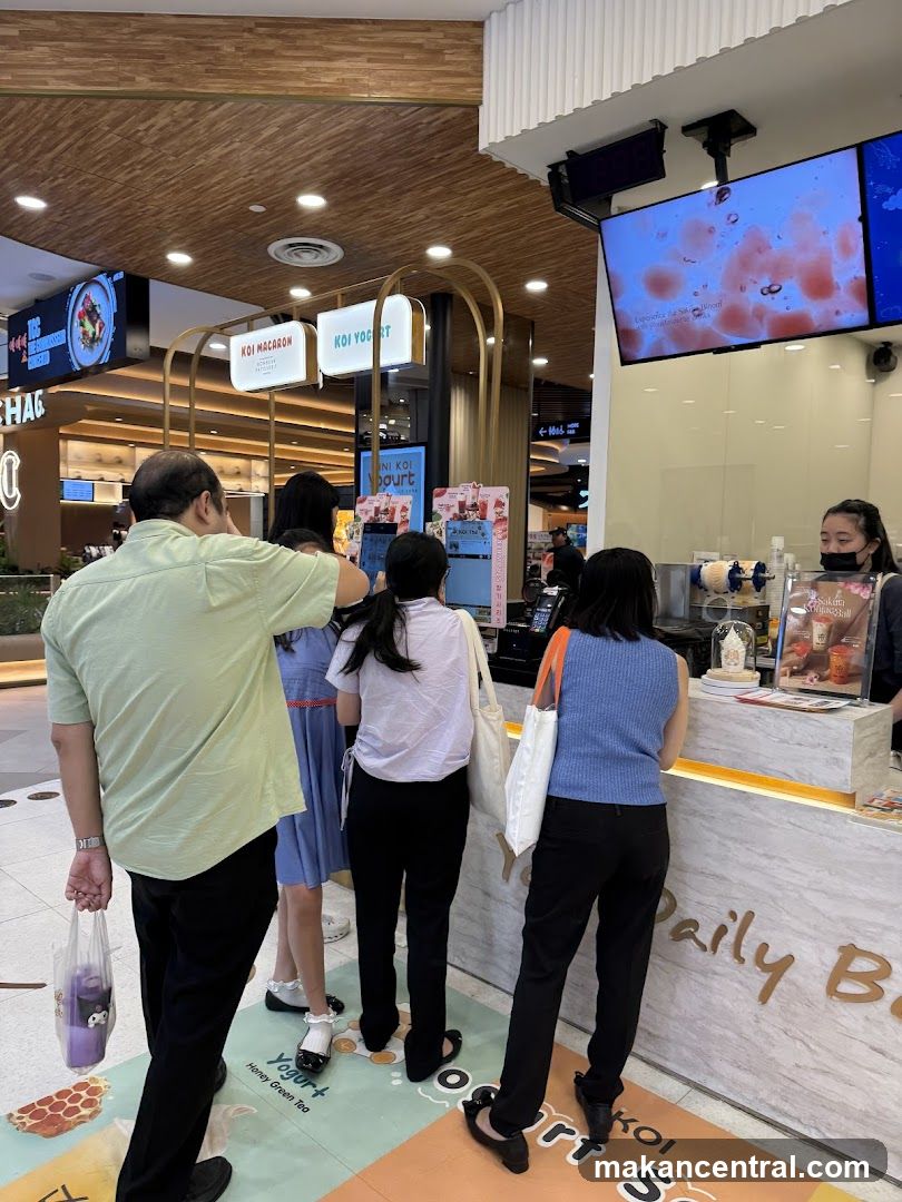 People Ordering at a Yogurt and Bubble Tea Shop