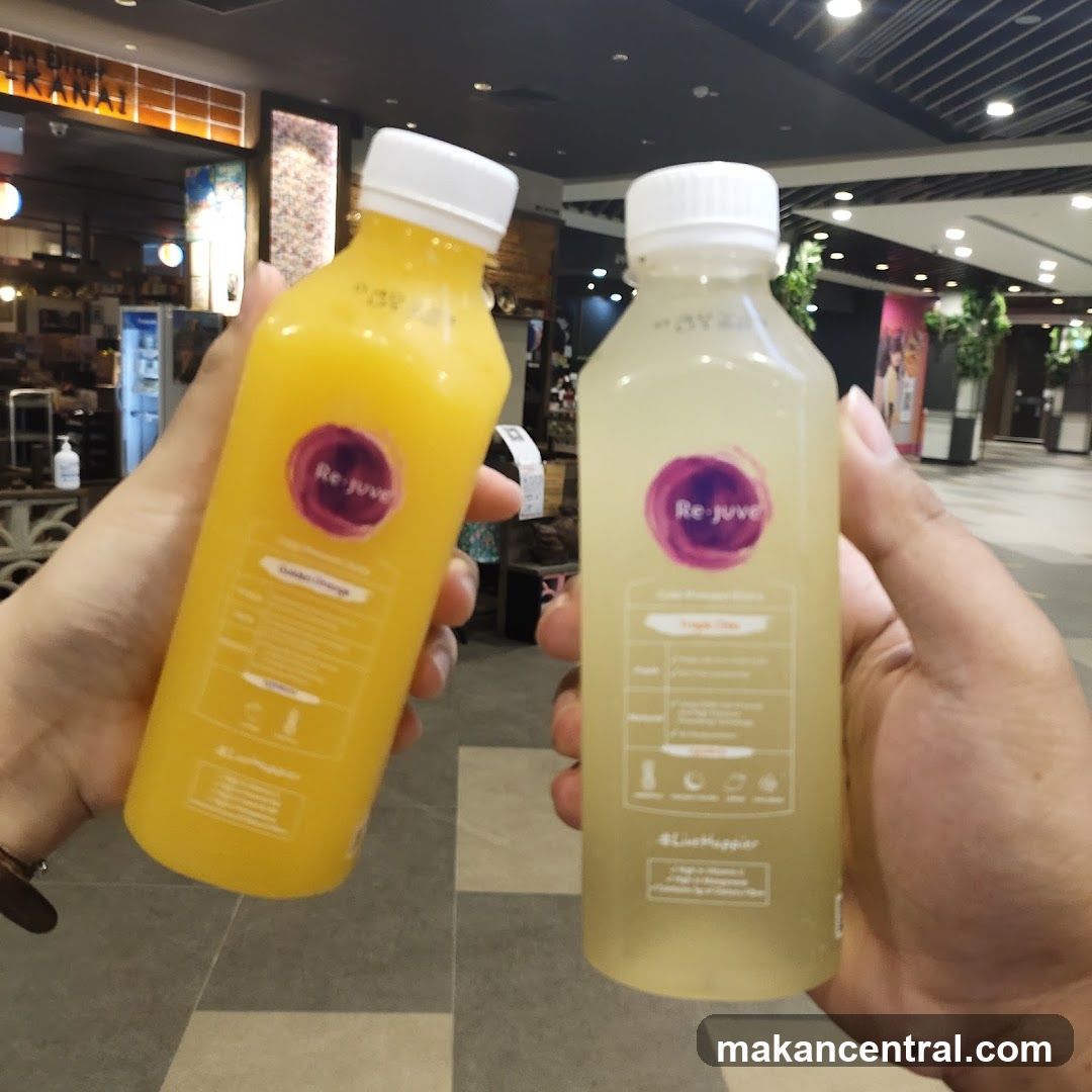 Two bottles of Rejuve cold-pressed juice