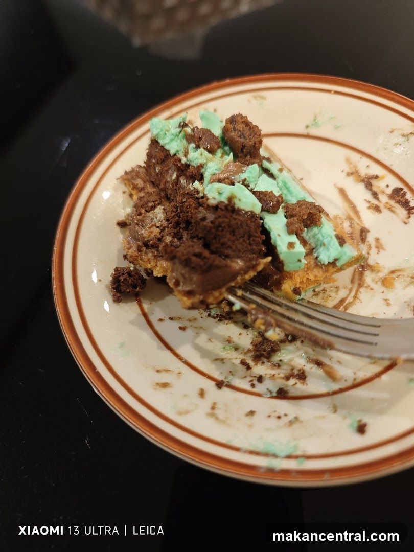 Partially Eaten Chocolate Cake with Mint Frosting