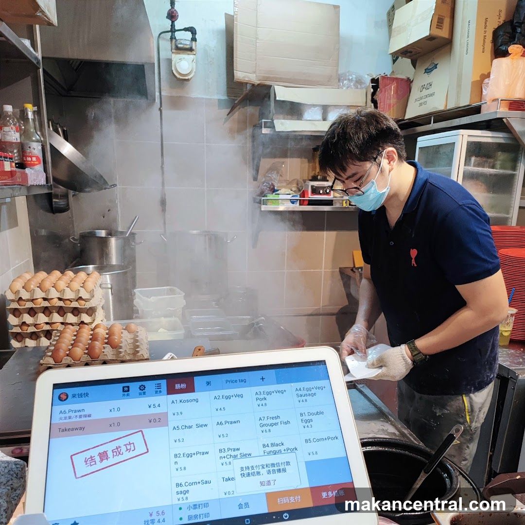 Kitchen staff using a tablet