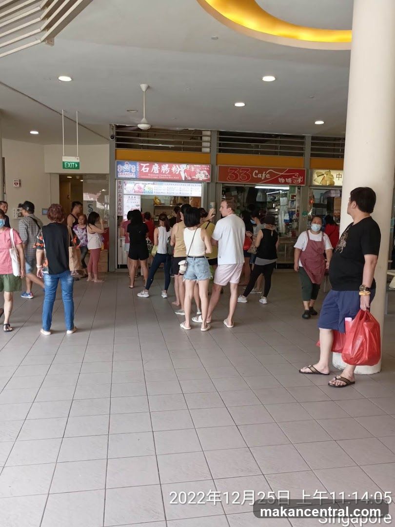 People queuing at a food stall