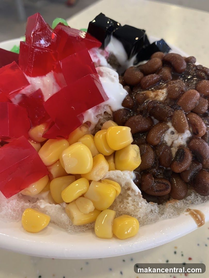 Dessert with shaved ice, corn, red jelly, and beans