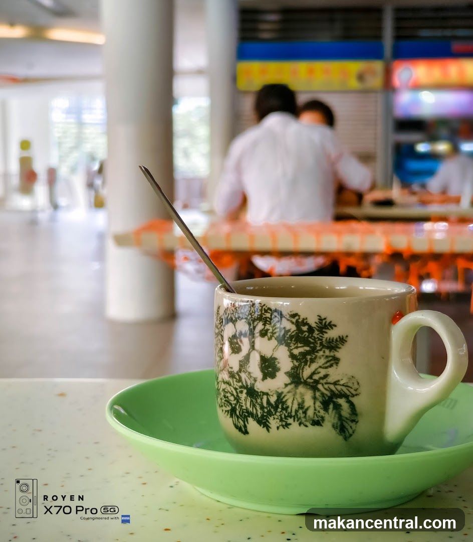 Coffee cup with spoon on saucer
