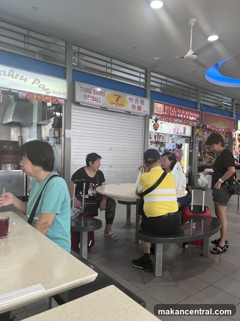 Food court interior with patrons and shops