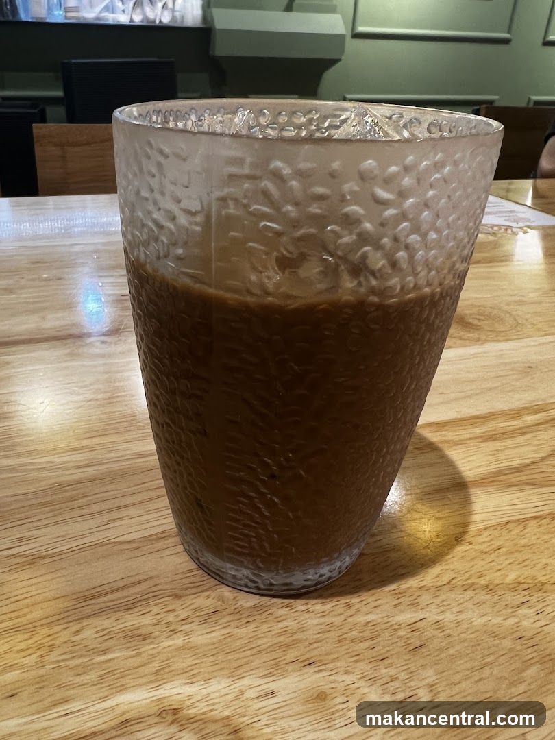 Coffee in textured glass on wooden table