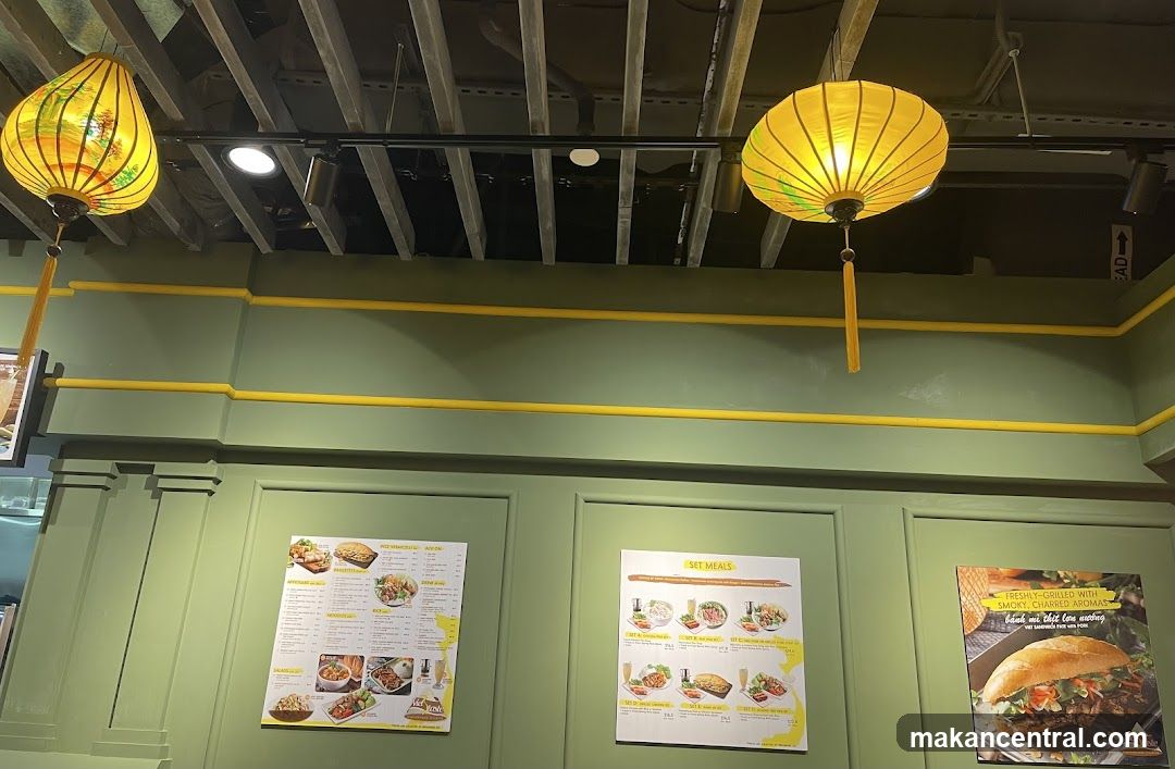 Interior of a restaurant with decorative lighting and menu boards