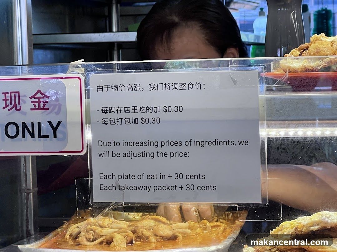 Food stall with price adjustment notice
