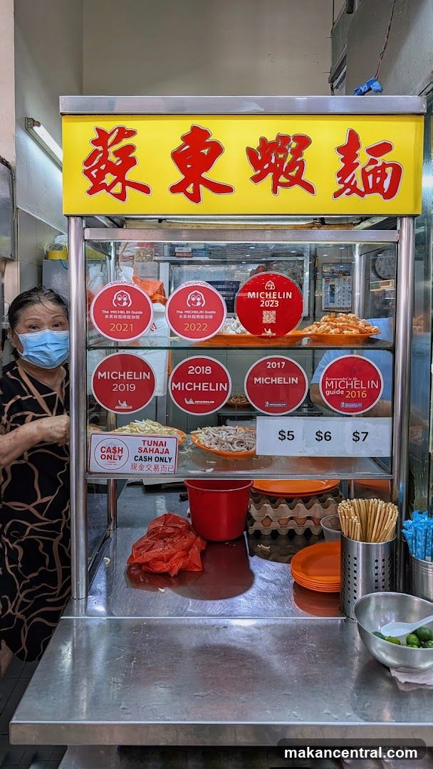 Food stall with Michelin awards display