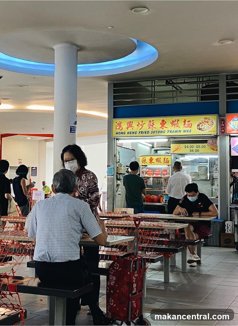 Food court interior with customers and stall