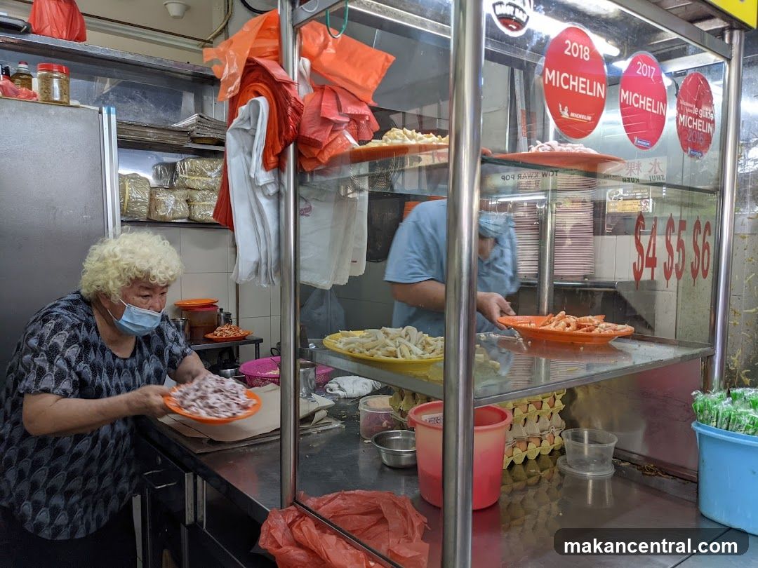 Food stall interior with Michelin awards signage