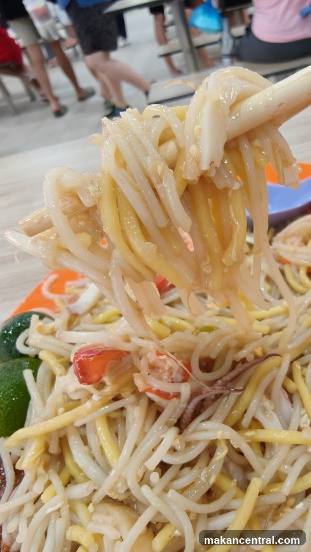 Noodles being lifted with chopsticks