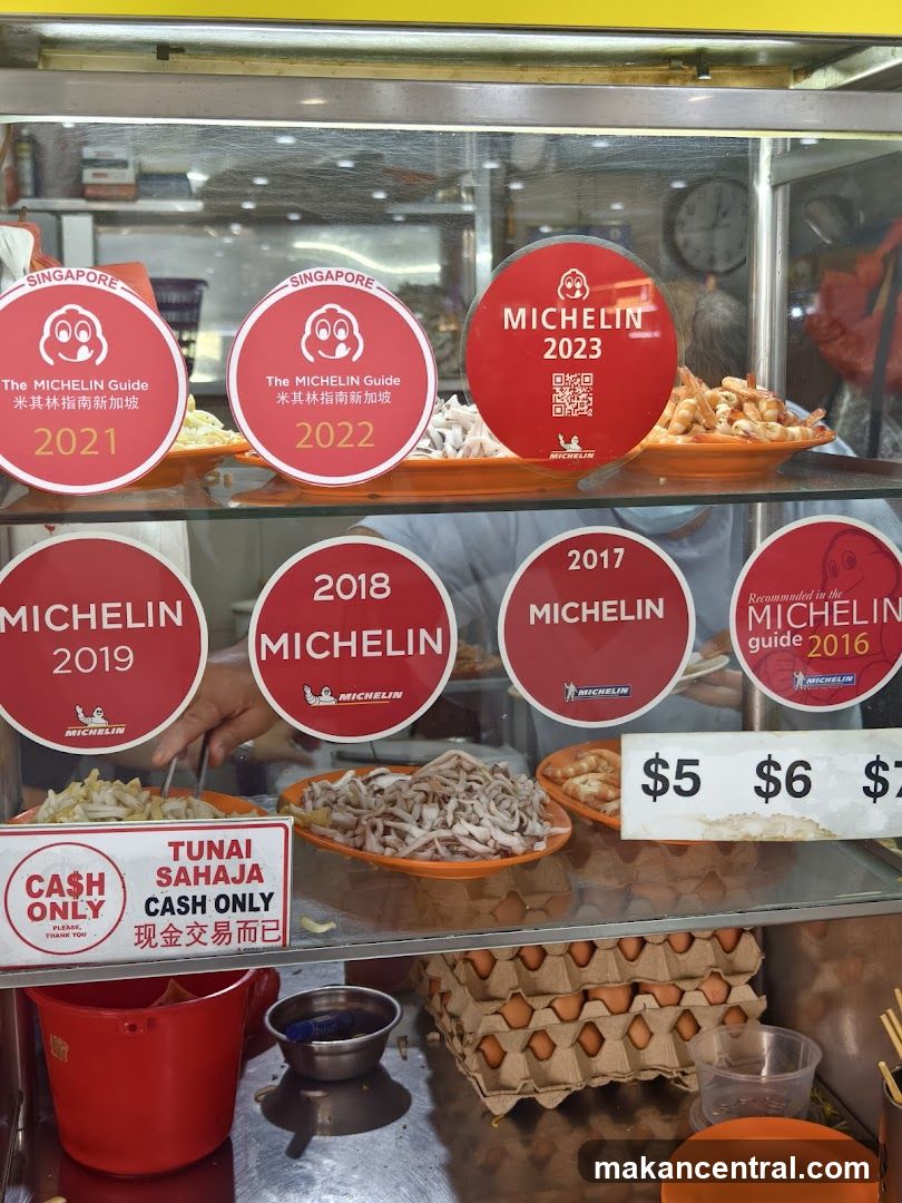 Food stall display with Michelin awards