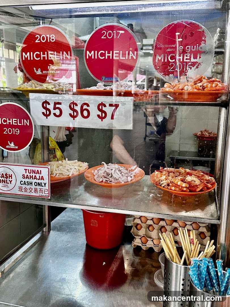 Food stall display with Michelin awards
