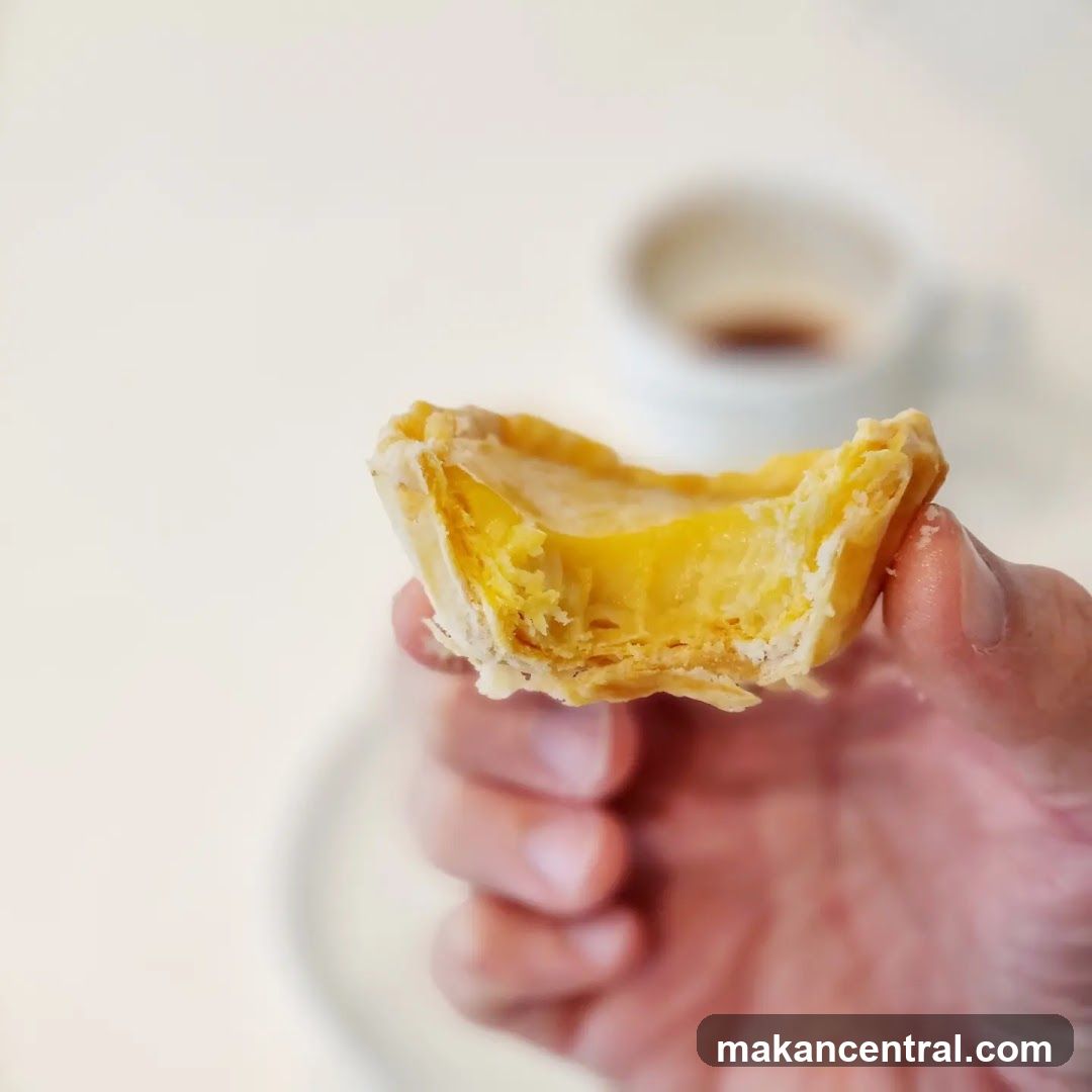 Hand holding a pastry