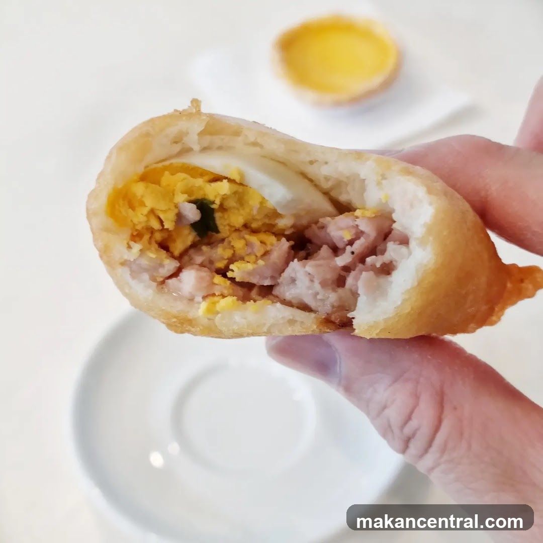 Hand holding a cut-open pastry