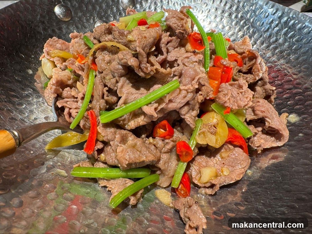 Cooked meat dish in a wok