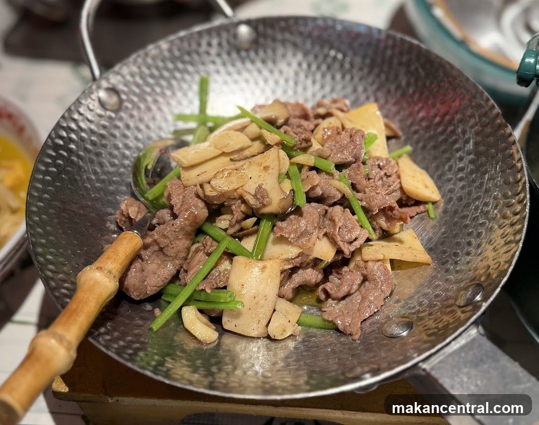 Stir-fried meat and vegetables in a wok