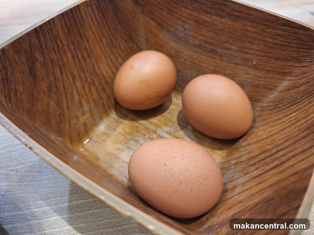 Eggs in wooden bowl