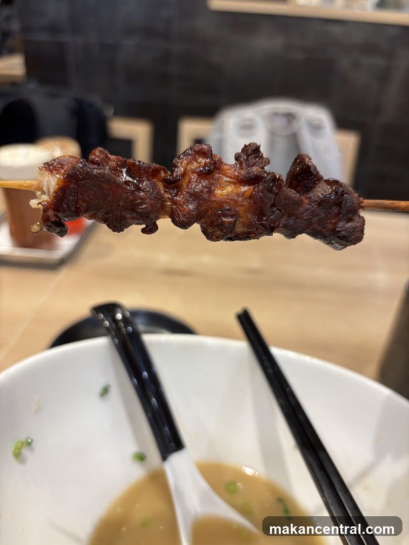 Grilled skewer with bowl of soup