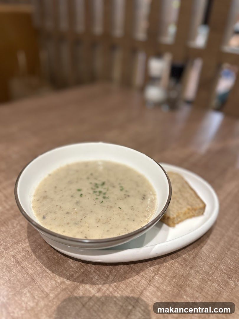 Soup and Bread on Wooden Table