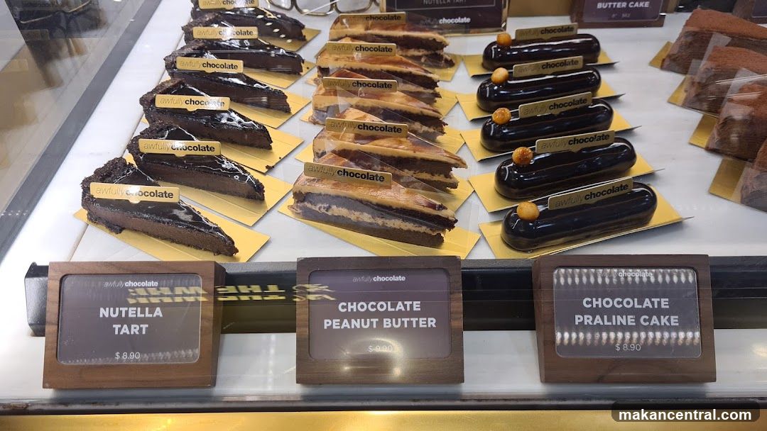 Display of chocolate desserts in a bakery case