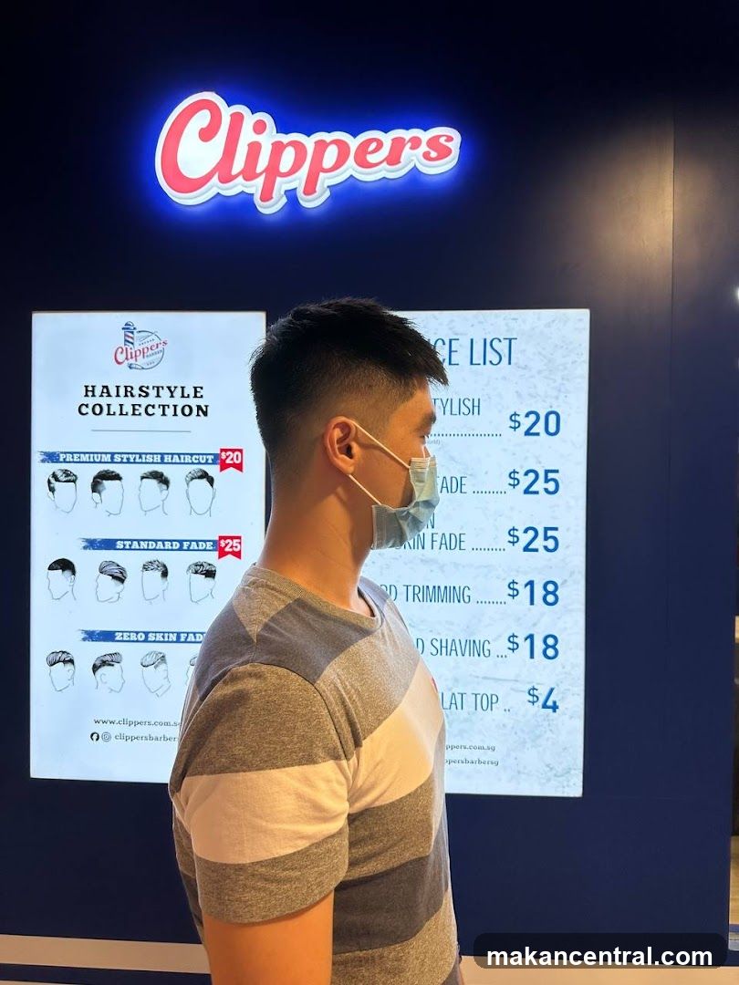 Person at Clippers Barber Shop Interior