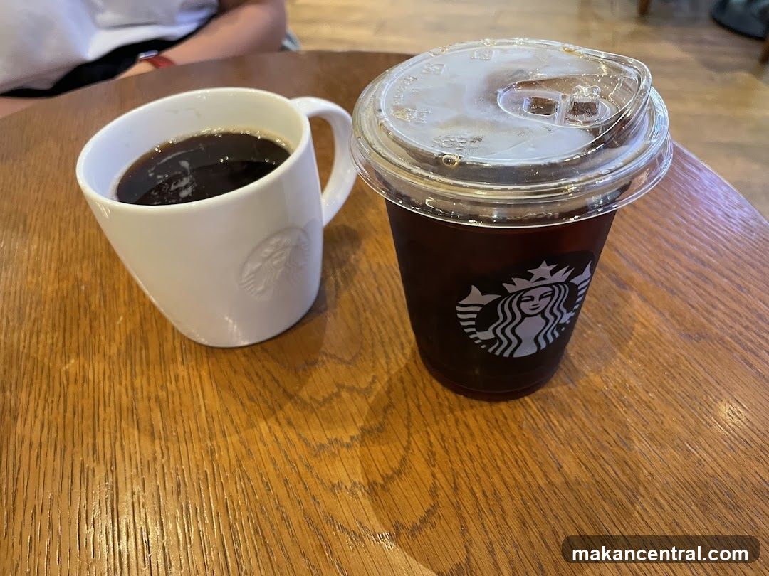 Starbucks Coffee Cup and Mug on Wooden Table