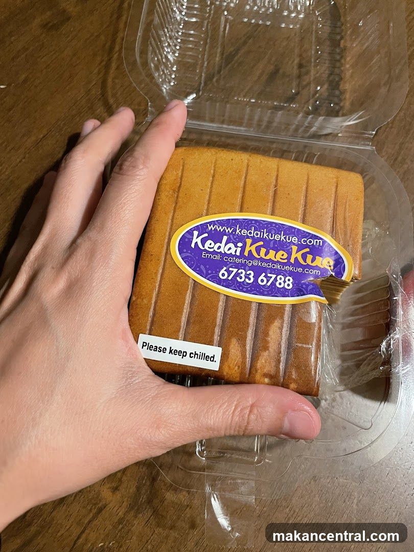 Hand holding packaged cake