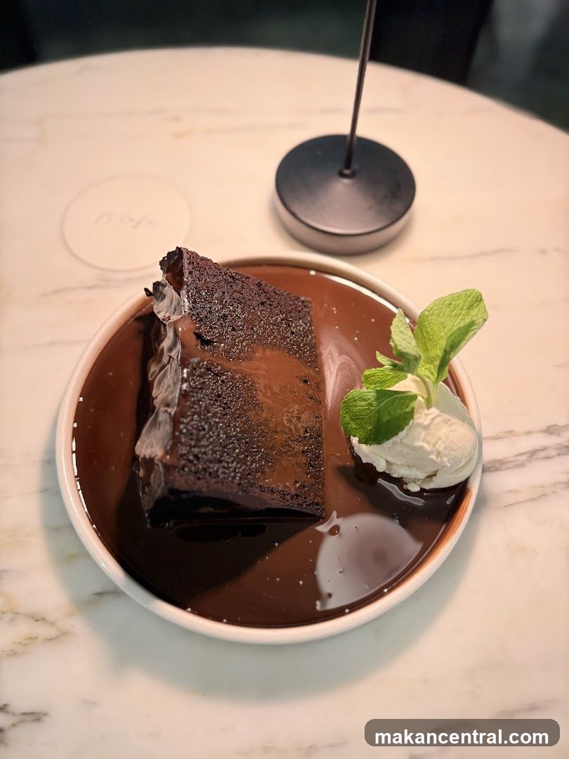 Chocolate dessert with ice cream and mint