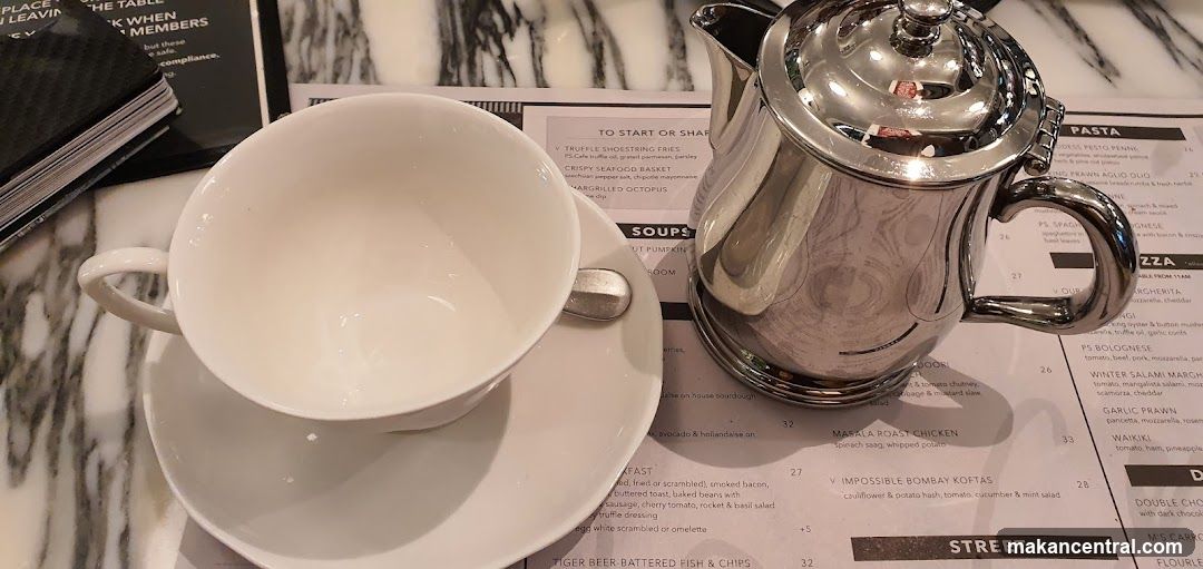 Table Setting with Menu and Teapot