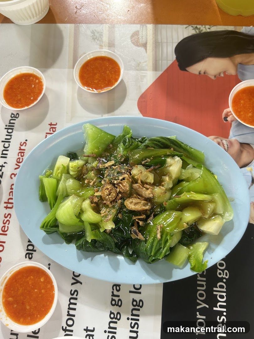 Dining Table with Vegetable Dish and Sauces