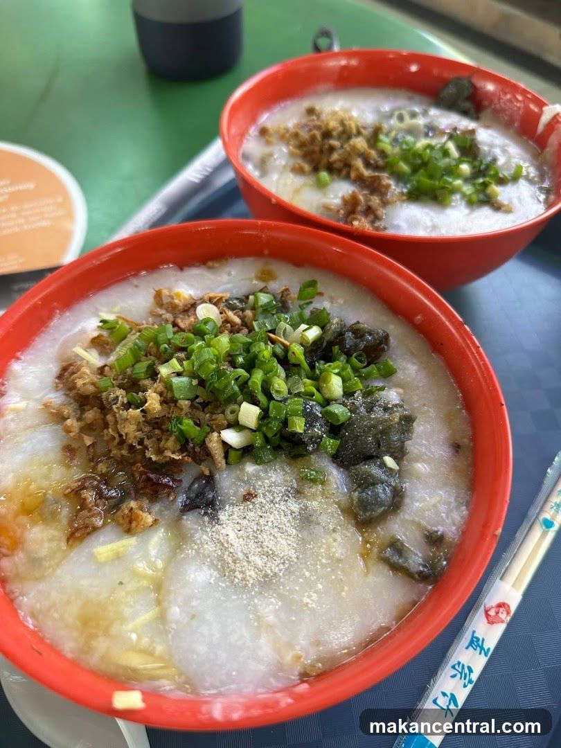 Two bowls of congee with toppings