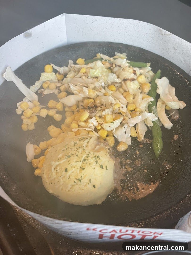 Sizzling Plate with Mashed Potatoes and Vegetables