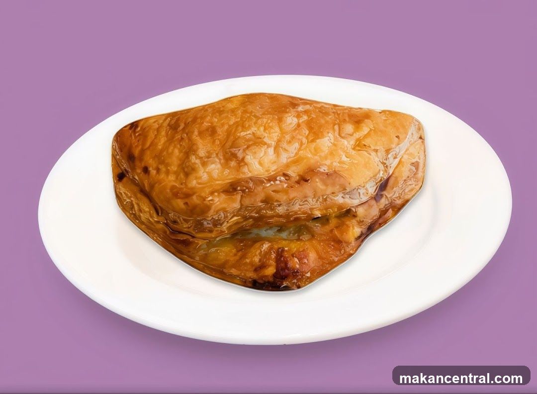 Golden Pastry on a White Plate