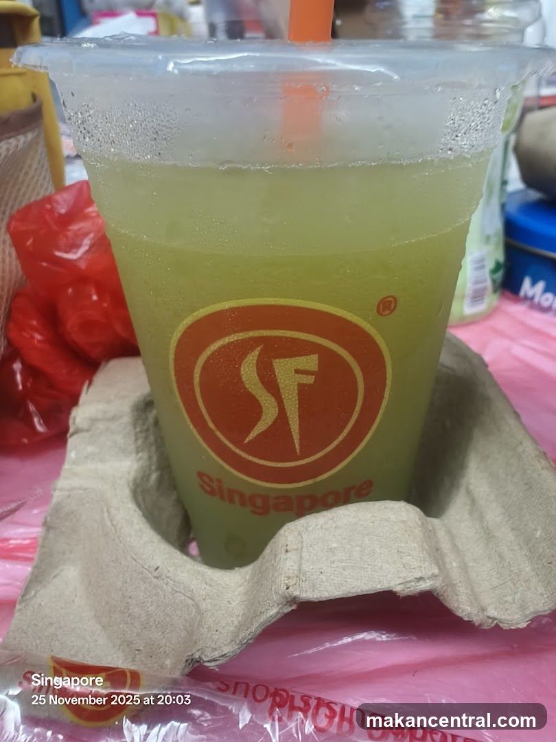 Green beverage in a cup with logo