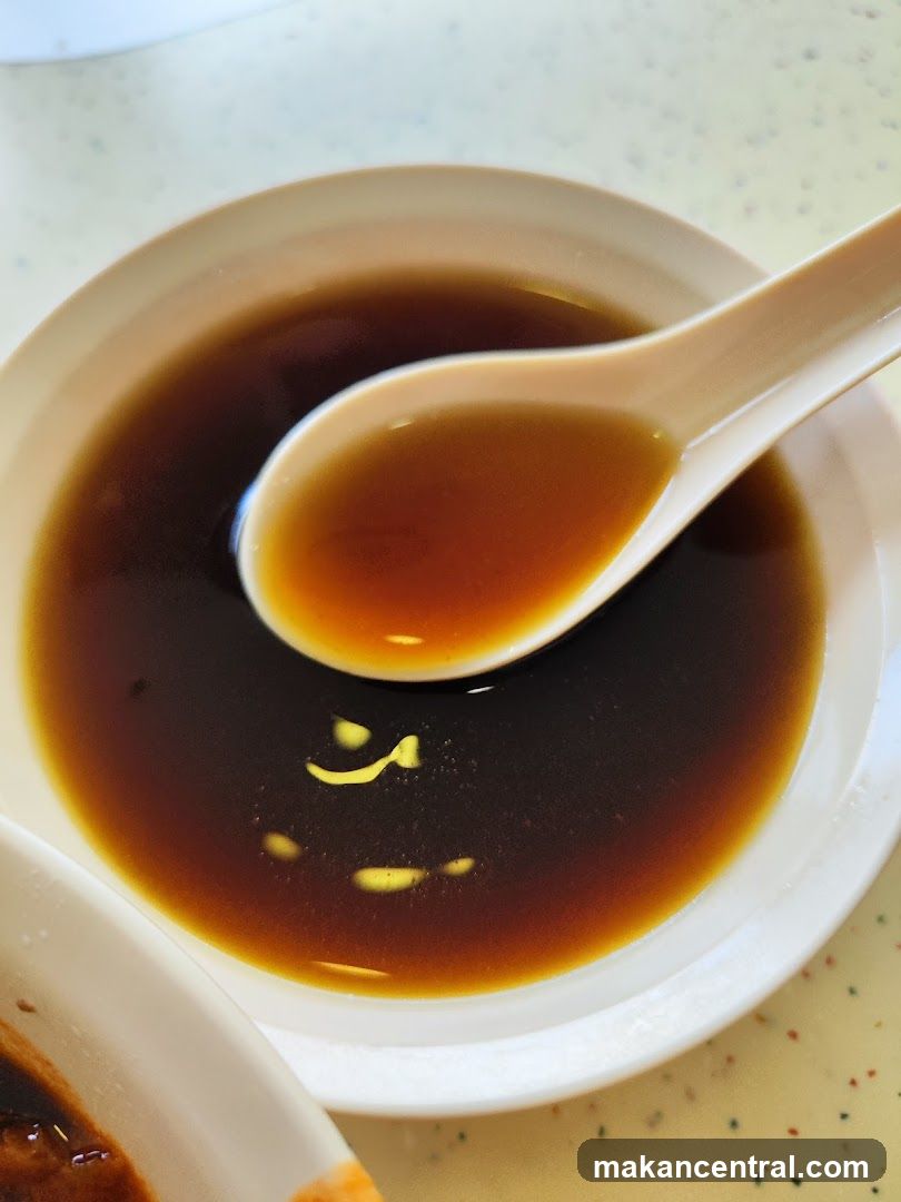 Bowl of dark liquid with spoon
