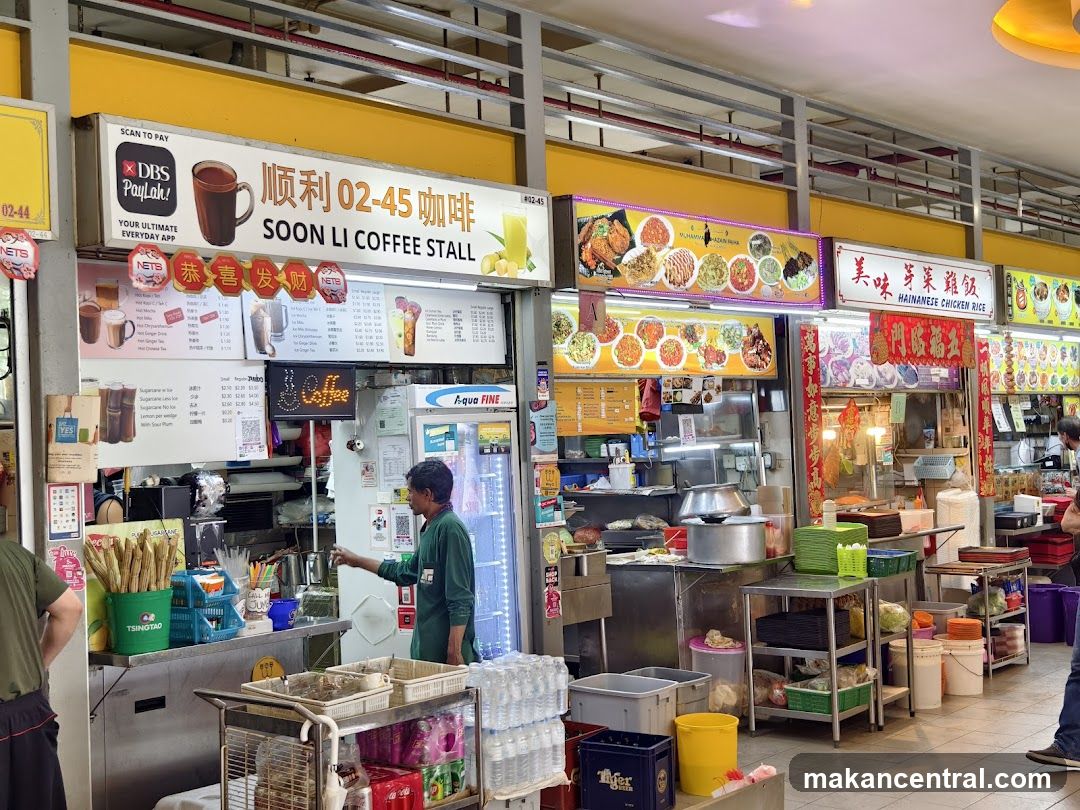 Inside a hawker center with multiple food stalls