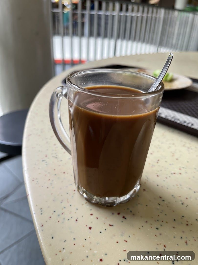 Coffee in a glass mug on speckled table