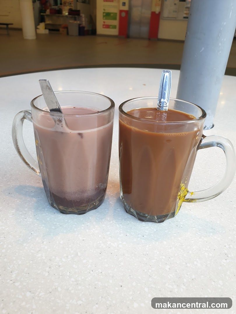 Two mugs of beverages on a table