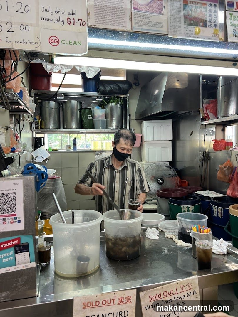 Beverage stall with a vendor preparing drinks