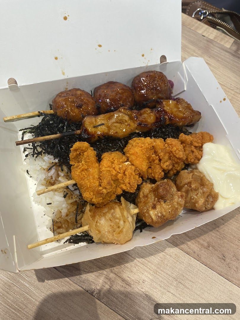 Bento Box with Skewers and Fried Items