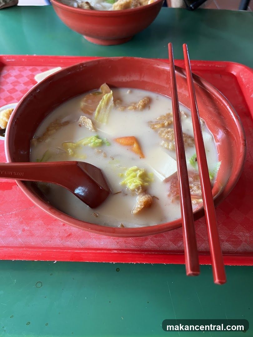 Bowl of Soup with Chopsticks