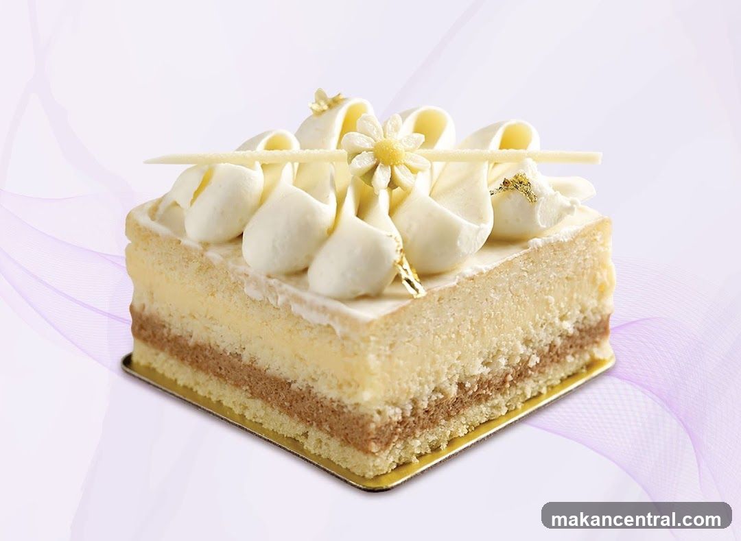 Layered Cake with White Frosting and Flower Decoration
