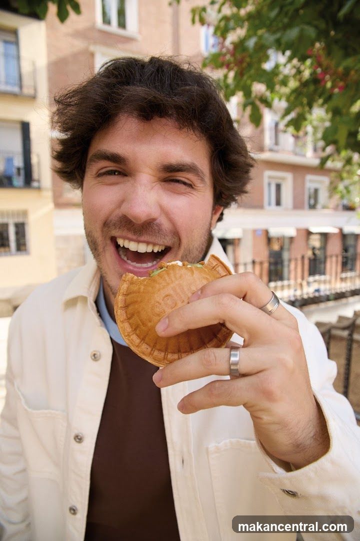 Man eating a pastry