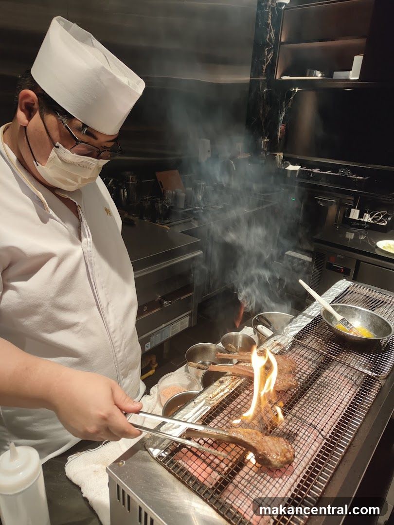 Chef grilling lamb chops