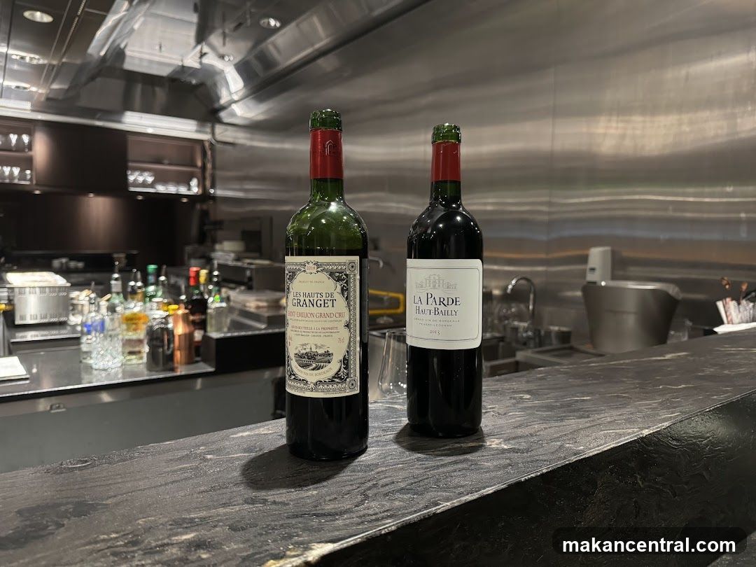 Two Bottles of Wine on a Bar